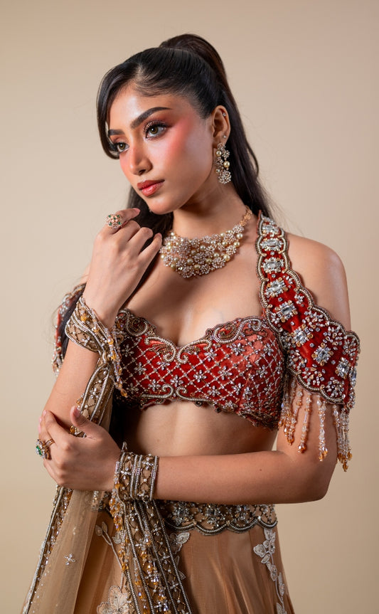 Hand embroidered tulle lehenga in gold & rust | Reception wear by Studio149, Chennai