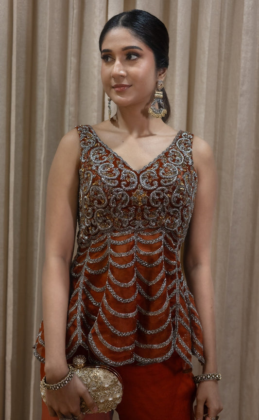 DESIGNER PEPLUM TOP AND PANTS IN RUST