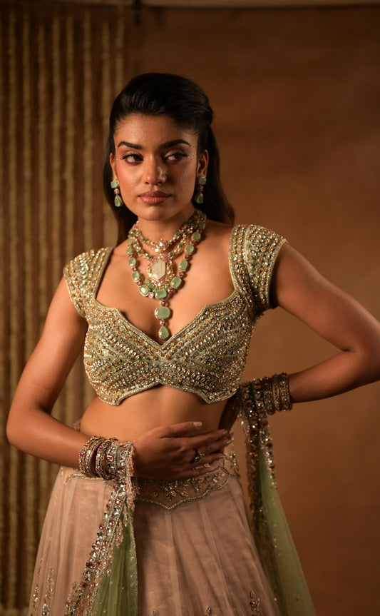 Hand embroidered tulle lehenga in rose gold & mint green | Reception wear by Studio149, Chennai