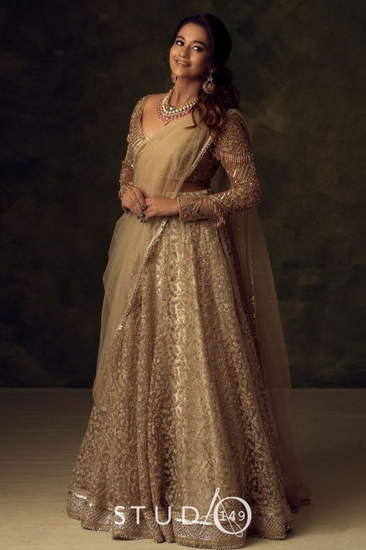 BRIDAL RECEPTION LEHENGA IN GOLD