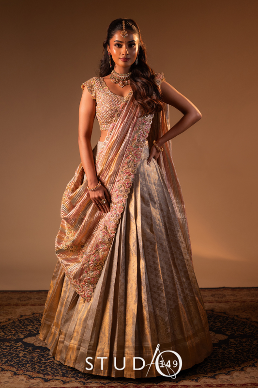 Contemporary half saree in gold | Bridal / Engagement wear by Studio 149, Chennai