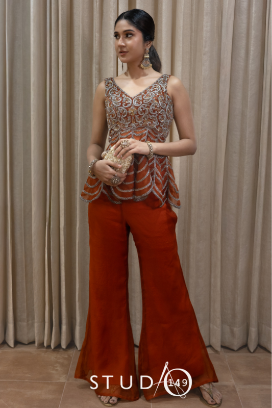 DESIGNER PEPLUM TOP AND PANTS IN RUST